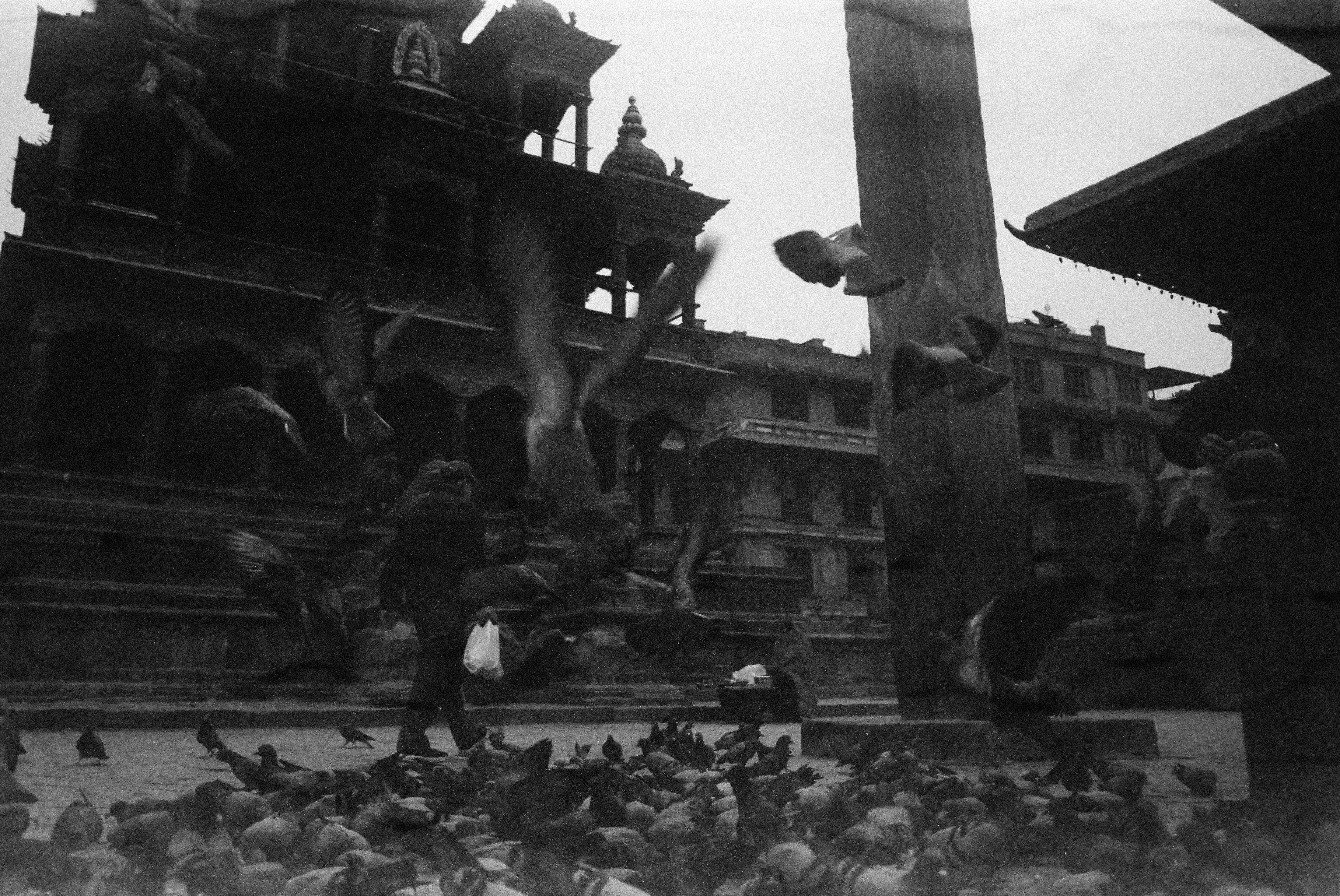 grayscale photo of people walking on street